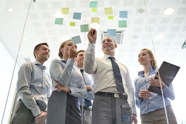 a group of people standing around each other.